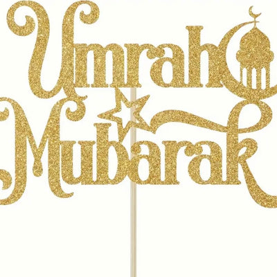 "Maak je taart compleet met de gouden Umrah Mubarak taarttopper. Een feestelijke en stijlvolle toevoeging."